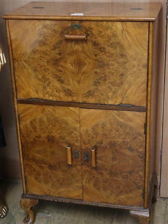 A figured walnut cocktail cabinet W.62cm